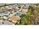 An aerial view of a community featuring various houses near a lake at 1636 Palace Ct, Port Charlotte, FL 33980