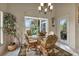 Breakfast nook with wicker chairs and glass table at 1636 Palace Ct, Port Charlotte, FL 33980