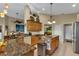 Granite countertops and wood cabinets in this kitchen at 1636 Palace Ct, Port Charlotte, FL 33980