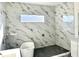 Elegant bathroom with soaking tub and marble tile at 16380 Cape Horn Blvd, Punta Gorda, FL 33955