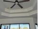 Bedroom with tray ceiling and large windows at 16380 Cape Horn Blvd, Punta Gorda, FL 33955