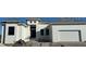 Modern two-story house with a metal roof and attached garage at 16380 Cape Horn Blvd, Punta Gorda, FL 33955