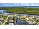 Aerial view of waterfront home with private dock and pool at 17032 Ohara Dr, Port Charlotte, FL 33948