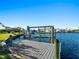 Private boat dock with lift on a tranquil canal at 18140 Bracken Cir, Port Charlotte, FL 33948