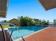 Inviting swimming pool with brick patio and fencing at 18140 Bracken Cir, Port Charlotte, FL 33948