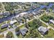 Aerial view of a house with a canal in the background, showing the surrounding neighborhood at 18514 Goodman Cir, Port Charlotte, FL 33948