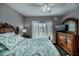 Spacious main bedroom with wood dresser and en-suite bathroom at 19385 Water Oak Dr # 304, Port Charlotte, FL 33948