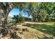 Large backyard with mature trees and plenty of green space at 21047 Baffin Ave, Port Charlotte, FL 33954