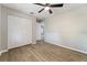 Bedroom with large closet and wood-look flooring at 21047 Baffin Ave, Port Charlotte, FL 33954
