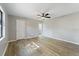 Bright bedroom with ceiling fan and wood-look flooring at 21047 Baffin Ave, Port Charlotte, FL 33954
