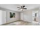 Bright bedroom with wood-look floors and a ceiling fan at 21047 Baffin Ave, Port Charlotte, FL 33954