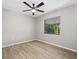 Light and airy bedroom with large window and ceiling fan at 21047 Baffin Ave, Port Charlotte, FL 33954