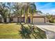 Nice house with a two-car garage and a well-maintained lawn at 21047 Baffin Ave, Port Charlotte, FL 33954