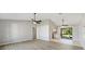 Open living and dining area with access to the kitchen at 21047 Baffin Ave, Port Charlotte, FL 33954