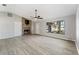 Spacious living area with a stone fireplace and large window at 21047 Baffin Ave, Port Charlotte, FL 33954