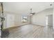 Living room with wood-look floors and a stone fireplace at 21047 Baffin Ave, Port Charlotte, FL 33954