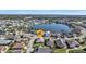 Aerial view of a house in a community with a lake at 24415 Buckingham Way, Punta Gorda, FL 33980