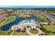 Aerial view of community with clubhouse, pool, and golf course at 24415 Buckingham Way, Punta Gorda, FL 33980