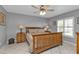 Spacious bedroom with wood bed frame and ample natural light at 24415 Buckingham Way, Punta Gorda, FL 33980