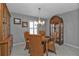 Bright dining room with a round table, four chairs, and built-in hutches at 24415 Buckingham Way, Punta Gorda, FL 33980