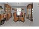 Charming dining area with a round table, four chairs, and built-in hutch at 24415 Buckingham Way, Punta Gorda, FL 33980