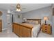 Main bedroom with king-size bed and ensuite bathroom access at 24415 Buckingham Way, Punta Gorda, FL 33980