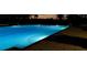 Night view of a community lap pool at 24415 Buckingham Way, Punta Gorda, FL 33980