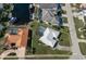Bird's-eye view showcasing home's layout, pool, and canal access at 2501 Rio Largo Ct, Punta Gorda, FL 33950