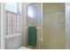 Clean bathroom with shower and a green towel at 2501 Rio Largo Ct, Punta Gorda, FL 33950