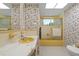 Retro bathroom with shower, toilet and floral wallpaper at 2501 Rio Largo Ct, Punta Gorda, FL 33950