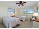Bright bedroom with two twin beds and window views at 2501 Rio Largo Ct, Punta Gorda, FL 33950
