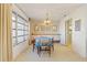 Dining room with built-in cabinetry and table for four at 2501 Rio Largo Ct, Punta Gorda, FL 33950