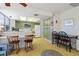 Retro kitchen with green cabinets, and a breakfast bar at 2501 Rio Largo Ct, Punta Gorda, FL 33950