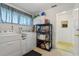 Laundry room with washer, dryer, and additional storage at 2501 Rio Largo Ct, Punta Gorda, FL 33950