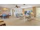 Bright living room with wicker furniture and view to the pool area at 2501 Rio Largo Ct, Punta Gorda, FL 33950