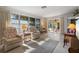 Living room with comfy armchairs and access to the pool area at 2501 Rio Largo Ct, Punta Gorda, FL 33950