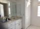 Clean bathroom with a vanity, toilet, and exterior access at 25200 Derringer Rd, Punta Gorda, FL 33983