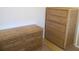 Two wooden dressers in a sunny bedroom at 25200 Derringer Rd, Punta Gorda, FL 33983