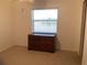 Simple bedroom with dresser and window at 25200 Derringer Rd, Punta Gorda, FL 33983