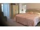 Main bedroom with a king-size bed and plenty of closet space at 25200 Derringer Rd, Punta Gorda, FL 33983