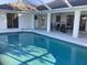 Inviting pool area with covered patio and seating at 25200 Derringer Rd, Punta Gorda, FL 33983