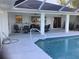 Pool and patio with seating area and lake view at 25200 Derringer Rd, Punta Gorda, FL 33983