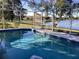 Relaxing pool with screened enclosure and lake view at 25200 Derringer Rd, Punta Gorda, FL 33983