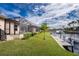 Waterfront backyard with canal access and lush landscaping at 3112 Tripoli Blvd, Punta Gorda, FL 33950