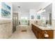 Elegant bathroom with double vanity, soaking tub, and walk-in shower at 3112 Tripoli Blvd, Punta Gorda, FL 33950
