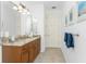 Clean bathroom with single vanity, granite countertop, and linen towels at 3112 Tripoli Blvd, Punta Gorda, FL 33950