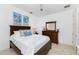 Bright bedroom with a double bed and wood furniture at 3112 Tripoli Blvd, Punta Gorda, FL 33950