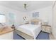 Cozy bedroom with a queen-size bed and light-colored furniture at 3112 Tripoli Blvd, Punta Gorda, FL 33950