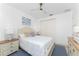 Bright bedroom with queen bed, light wood furniture, and blue rug at 3112 Tripoli Blvd, Punta Gorda, FL 33950