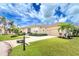 One story house with a paved driveway and lush landscaping at 3112 Tripoli Blvd, Punta Gorda, FL 33950